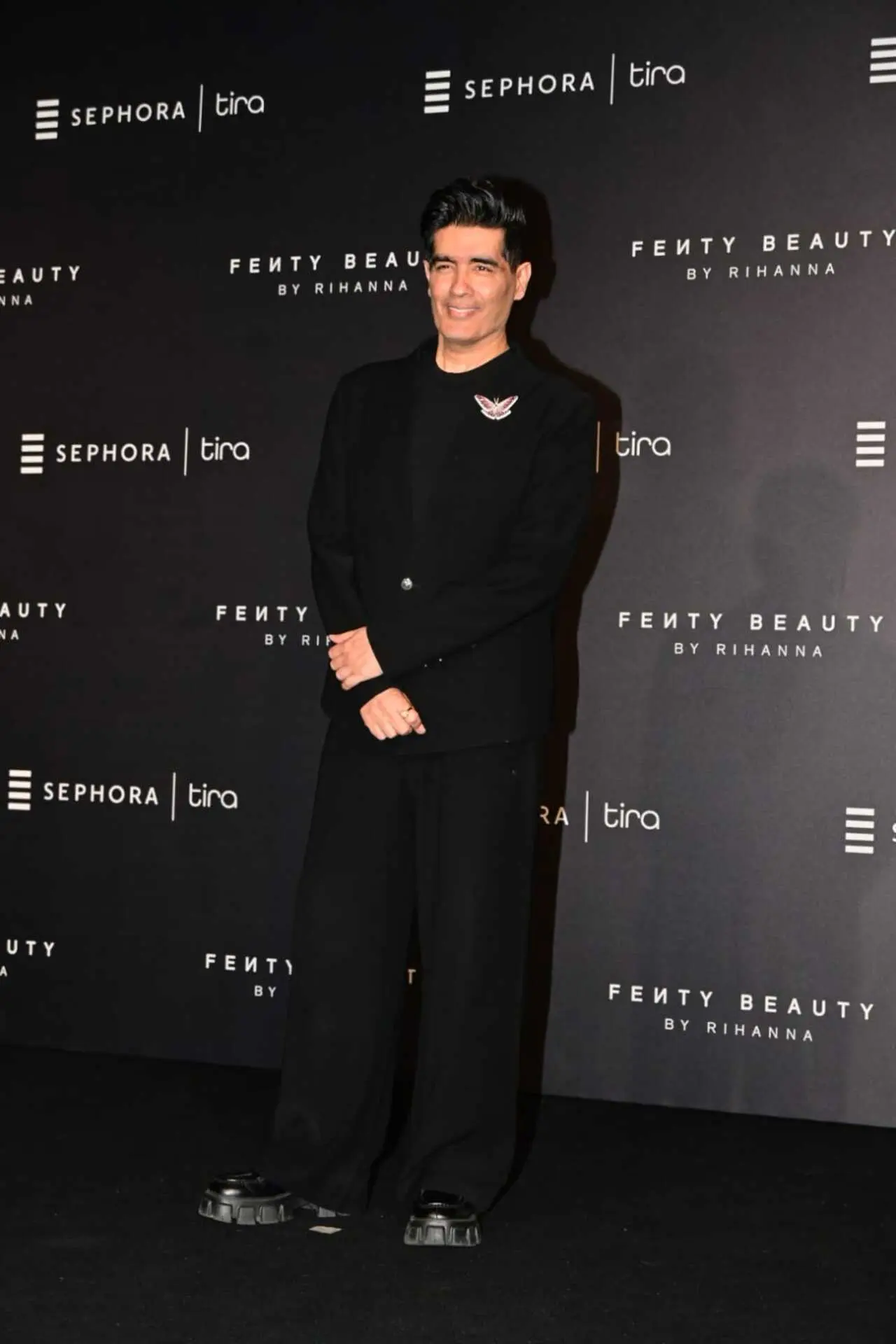 Designer Manish Malhotra arrived in a black suit completed with a golden brooch.&nbsp;